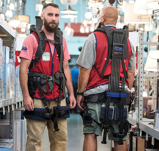 Lowe's employees demostrate the exosuit'