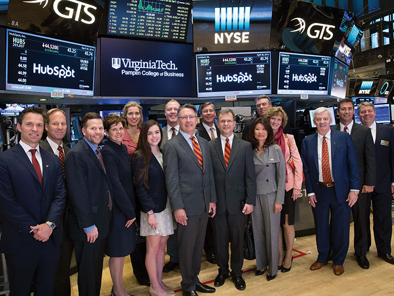 Virginia Tech President Tim Sands and alumni at the New York Stock Exchange
